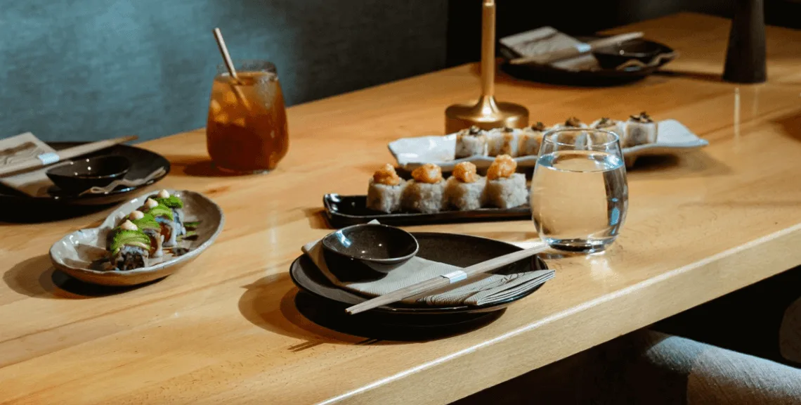 Sushi rolls on plate on table